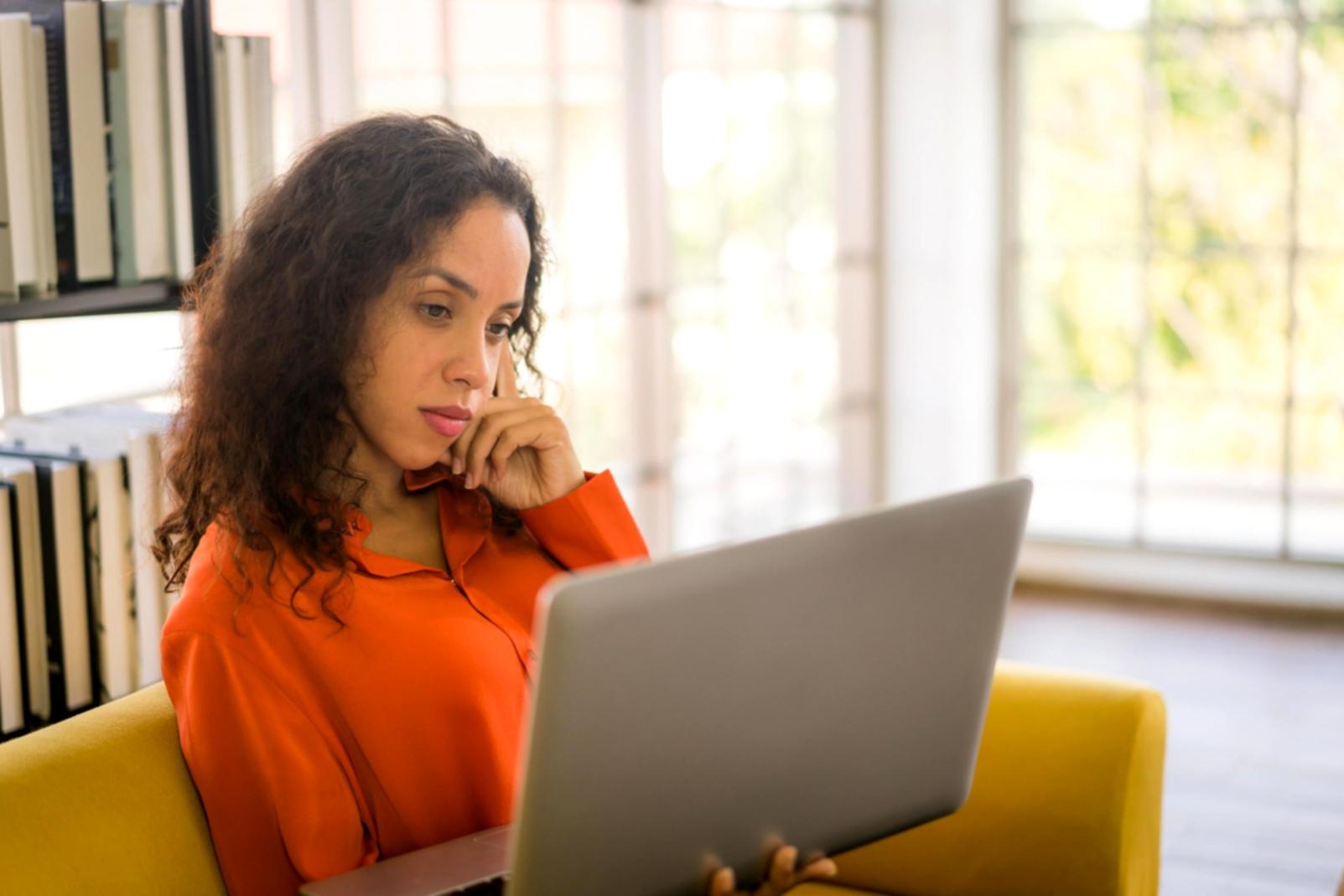 Person reviewing financial documents and budget planning materials
